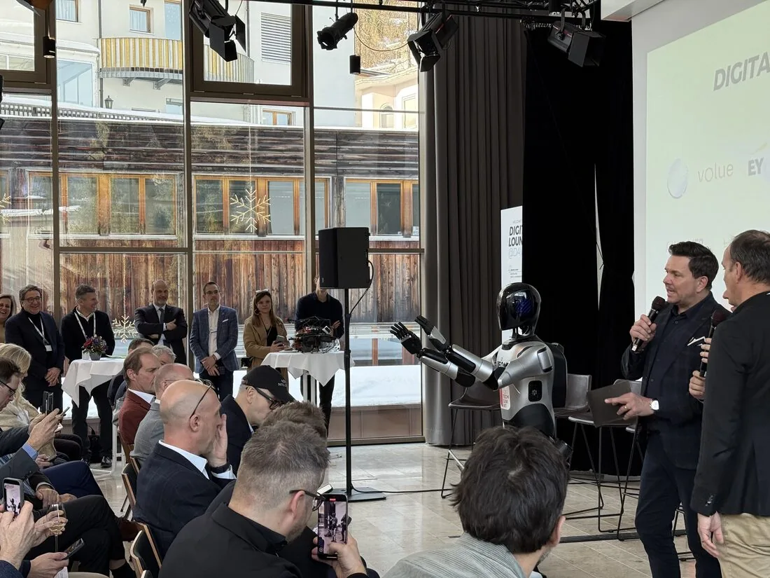 A2 Ultra on stage gesturing during a panel discussion at the Digital Lounge during Davos WEF