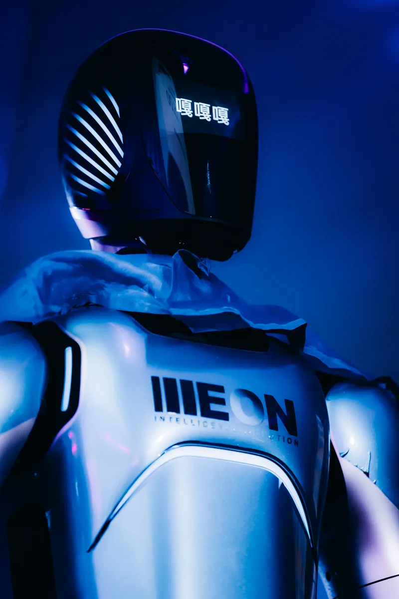 ILLEON-branded A2 Ultra robot close-up under blue stage lighting at the LoveTomorrow event