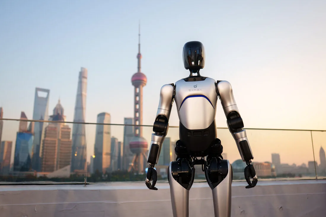 A2 Ultra standing on a rooftop with the Shanghai skyline and Oriental Pearl Tower in the background